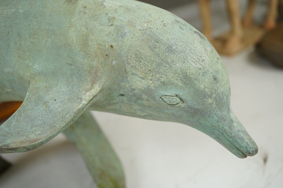 A patinated bronze dolphin group, 49cm high. Condition - some foxing to surface